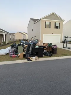Before: curbside junk pile in front of a home